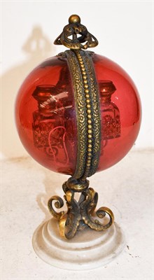 Lot 167 - A 19th century French pedestal scent casket, spherical cranberry glass with gilt metal mounts,...