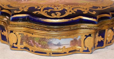 Lot 173 - Sevres style trinket box with gilt metal mount, ground in cobalt blue and painted with a scene...