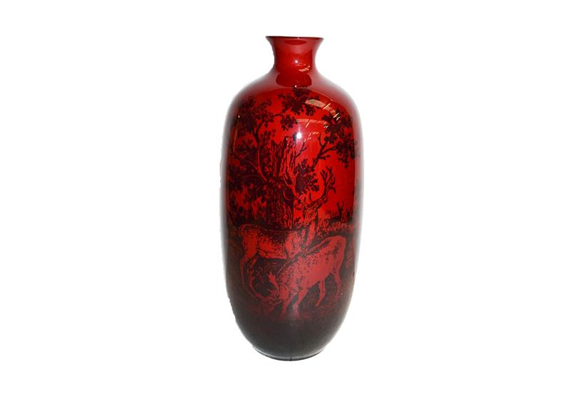 Lot 186 - A Royal Doulton flambe vase, decorated with stags, printed factory marks and woodcut, 29cm