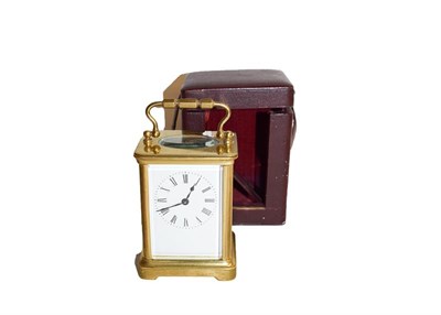 Lot 192 - A French brass cased carriage timepiece, circa. 1900 in leather travelling case