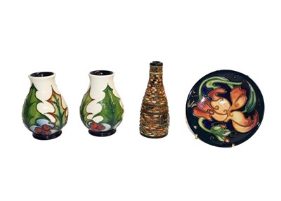 Lot 196 - Two modern Moorcroft Holly pattern vases, designed by Phillip Gibson, 10cm, a Miss Alice...