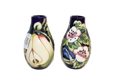 Lot 202 - A pair of modern Moorcroft Cawthorne pattern vases, designed by Emma Bossons, 4/150 and 10/150,...
