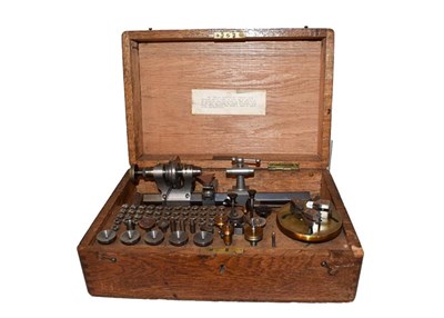 Lot 235 - A TCM Co Ltd London watchmakers lathe with collets, in wooden box