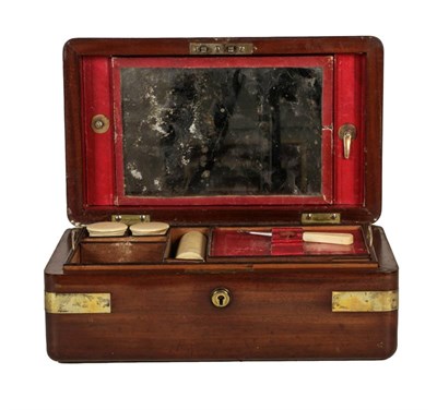 Lot 241 - An early 19th century mahogany campaign gentleman's vanity box, brass bound and with leather fitted