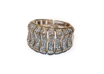 Lot 266 - A diamond ring, formed of graduated undulating panels set throughout with eight-cut diamonds,...