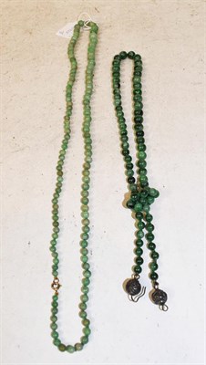 Lot 269 - A graduated jade bead necklace; two pairs of jade drop earrings; and a nephrite bead necklace