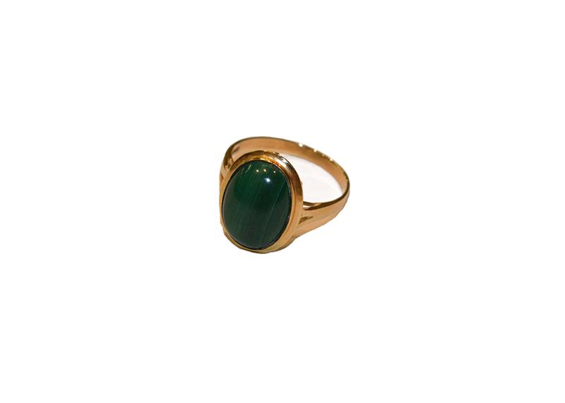 Lot 271 - A malachite ring, stamped '18K750', finger size P