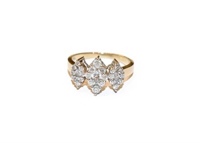 Lot 277 - A diamond triple cluster ring, the graduated kite shaped clusters set throughout with round...