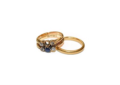 Lot 293 - A 22 carat gold band ring, finger size R; and an 18 carat gold synthetic sapphire and diamond ring