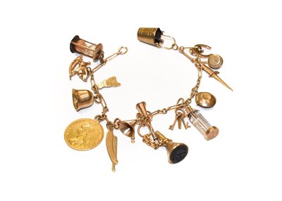 Lot 295 - A figaro link bracelet, stamped '9' and '.375', hung with various charms including a hunting...