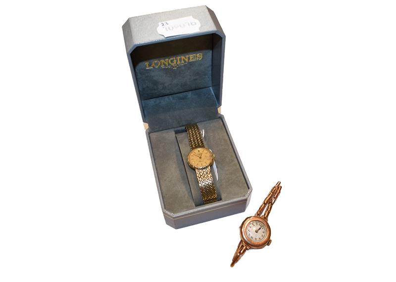 Lot 306 - A lady's 9 carat gold quartz wristwatch, signed Longines, integral bracelet with clasp stamped 375