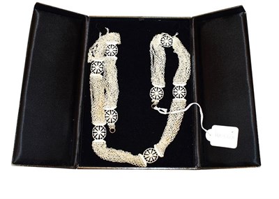 Lot 321 - An early 18th century carved bone necklace, composed of ten rows of carved bone loop-in-loop...