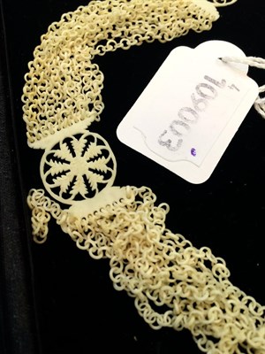Lot 321 - An early 18th century carved bone necklace, composed of ten rows of carved bone loop-in-loop...