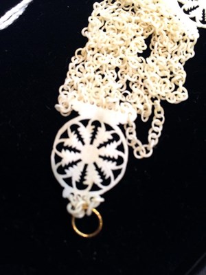 Lot 321 - An early 18th century carved bone necklace, composed of ten rows of carved bone loop-in-loop...