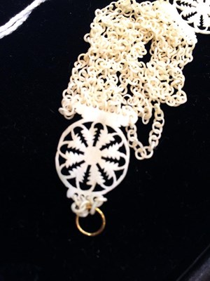 Lot 321 - An early 18th century carved bone necklace, composed of ten rows of carved bone loop-in-loop...