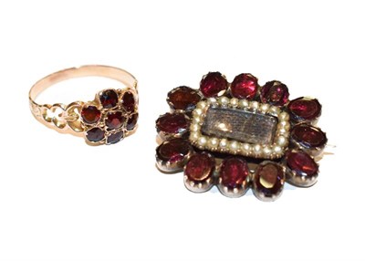 Lot 325 - A garnet and split pearl mourning brooch, measures 2.8cm by 2.3cm; and a garnet cluster ring,...