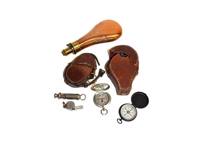 Lot 345 - Two leather cased WWI compasses, two other small compasses, shot powder flask, and two whistles...