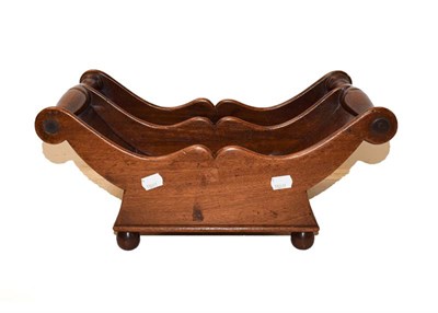 Lot 358 - A 19th century mahogany cheese cradle with turned handles and raised on ball feet, 43cm by 24cm...