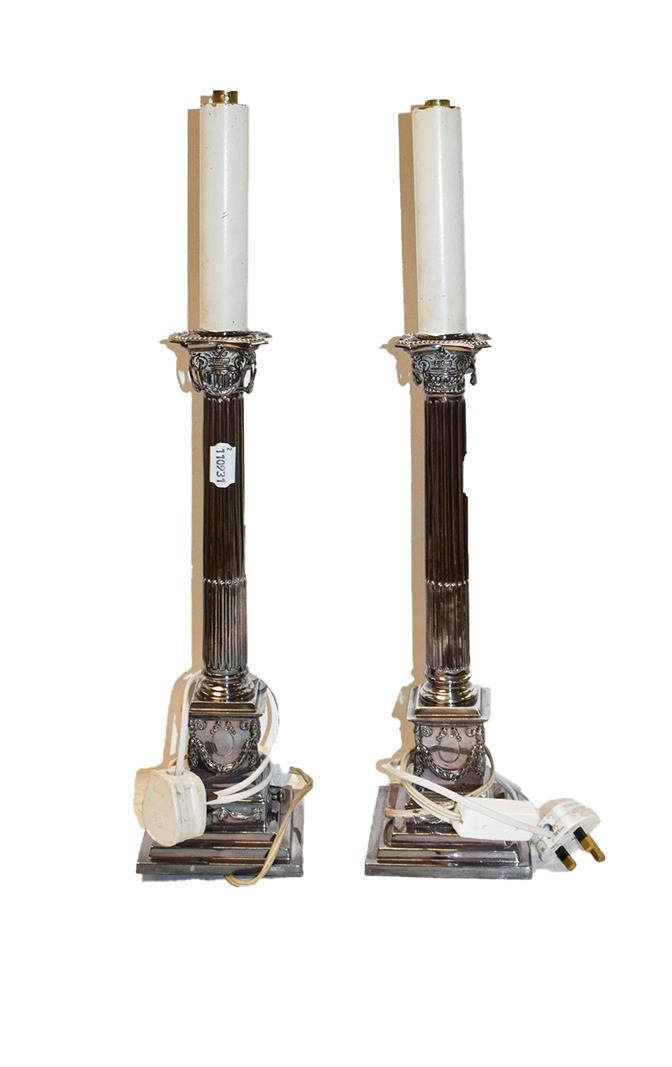 Lot 366 - A pair of early 20th century silver plated table lamps of corinthean column form, 39cm to top...