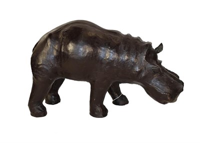 Lot 389 - A dark leather clad hippo approx 43cm by 27cm