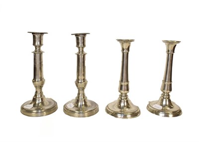 Lot 394 - A pair of 19th century pewter ejector candlesticks of cannon barrel form, together with another...