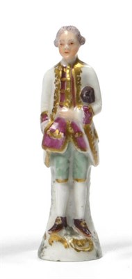 Lot 120 - A German Porcelain Pipe Tamper, late 18th century, in the form of a gentleman wearing a gilt...