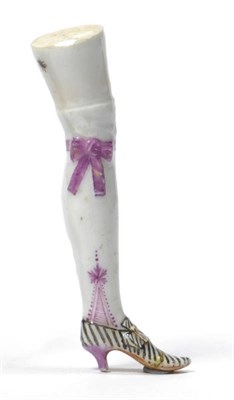 Lot 122 - A German Porcelain Pipe Tamper, probably Vienna, circa 1750, in the form of a leg with a pink...