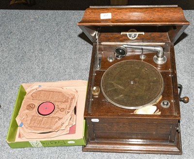 Lot 457 - A Columbia wind up gramophone with discs