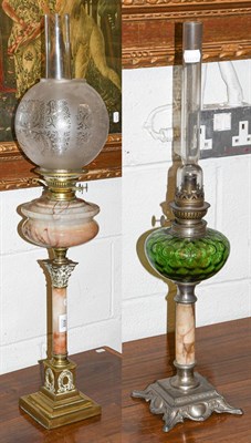 Lot 459 - Early 20th century oil lamp with globe shade and another lamp (2)