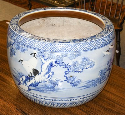 Lot 462 - An early 20th century Japanese Arita blue and white porcelain planter, decorated with a...