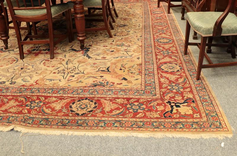 Lot 1078 - Oriental Carpet, the cream field of scrolling tendrils flowers and plants around a medallion framed