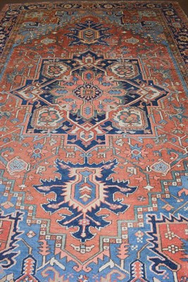 Lot 1085 - Heriz Carpet, the terracotta field of angular vines centred by a typical medallion framed by...