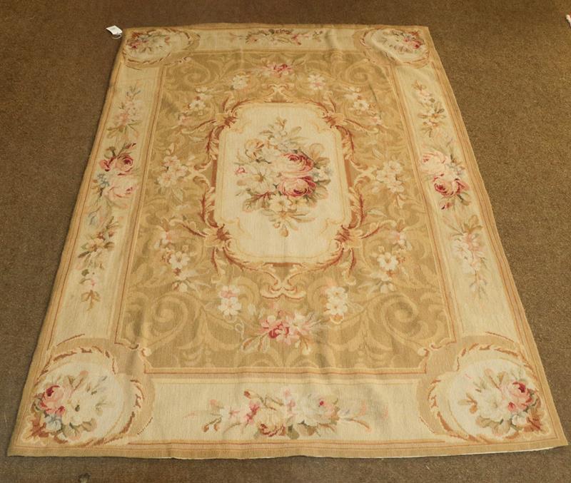 Lot 1090 - Chinese neddlepoint rug of Aubusson design the field with a panel of naturalistic roses enclosed by