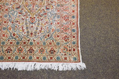Lot 1092 - Hereke silk prayer rug, the ivory field with issuing flowers beneath the Mihrab framed by upper...