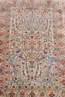 Lot 1092 - Hereke silk prayer rug, the ivory field with issuing flowers beneath the Mihrab framed by upper...