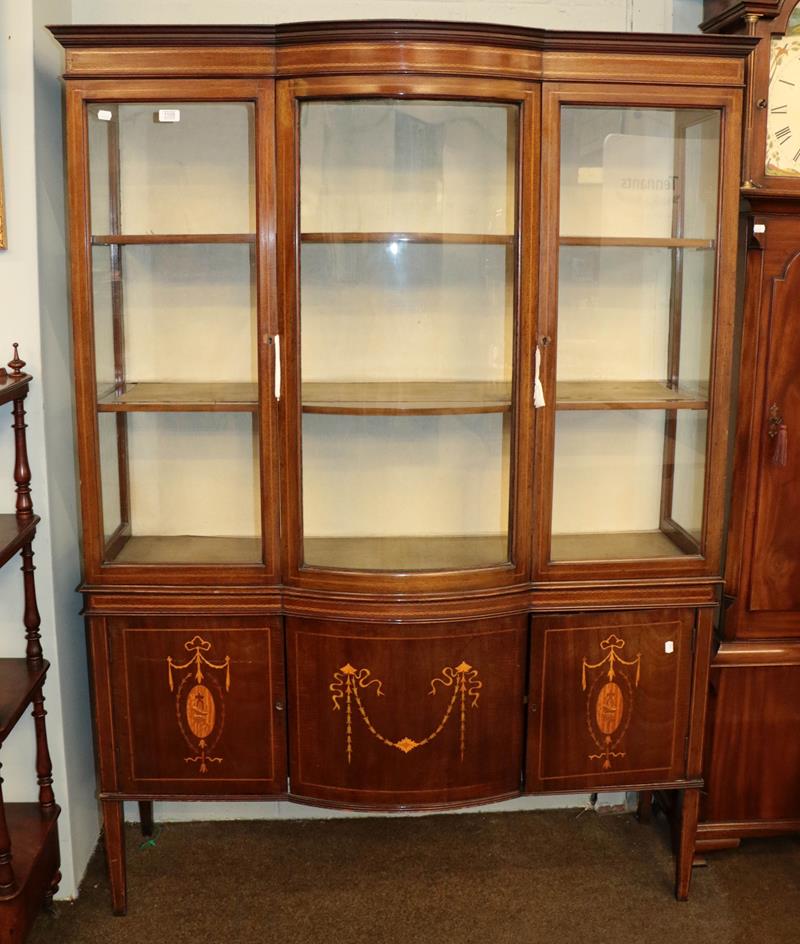 Lot 1105 - An Edwardian inlaid mahogany bow front display cabinet, 137cm by 40cm by 188cm