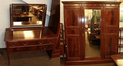 Lot 1108 - An Edwardian mahogany mirror fronted triple wardrobe, crossbanded and with egg and dart...