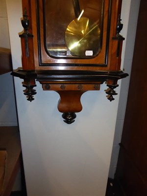 Lot 1112 - A Vienna type walnut veneered double weight striking wall clock circa. 1890, 127cm high