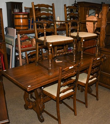 Lot 1113 - A Mellowcraft oak dining suite comprising dining table, six dining chairs, Welsh dresser and rack
