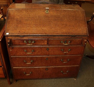 Lot 1128 - A George III oak bureau with fitted interior, 91cm by 52cm by 97cm