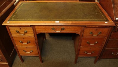 Lot 1129 - An early 20th century mahogany pedestal desk with green leather top