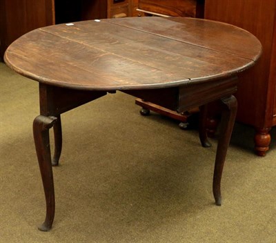 Lot 1133 - An 18th century oak drop leaf table, 125m by 110cm by 70cm