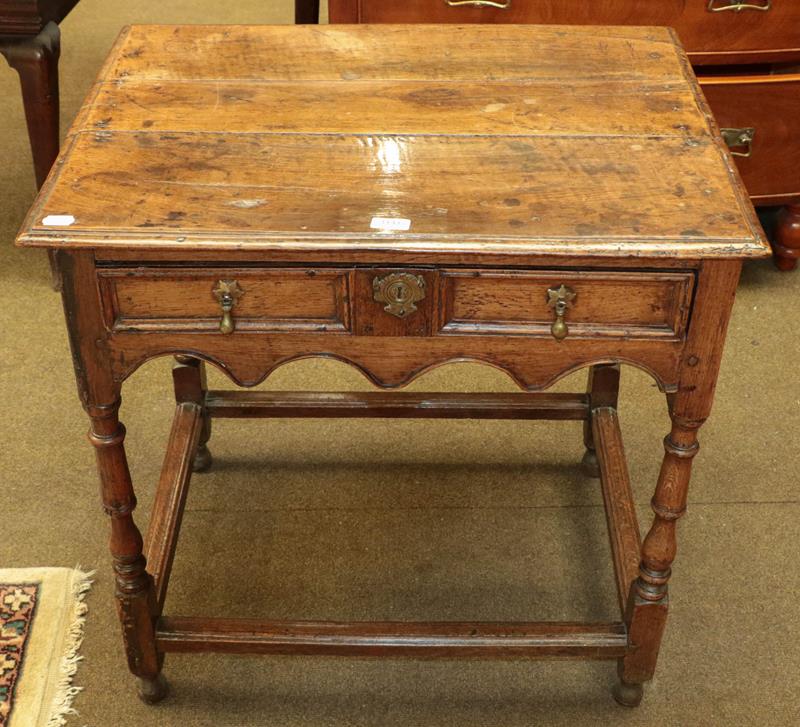 Lot 1141 - An 18th century oak single-drawer side table, 76cm by 57cm by 75cm