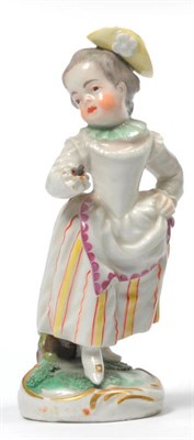 Lot 138 - A Frankenthal Porcelain Figure of a Girl, 1782, wearing a yellow cap and yellow and red striped...