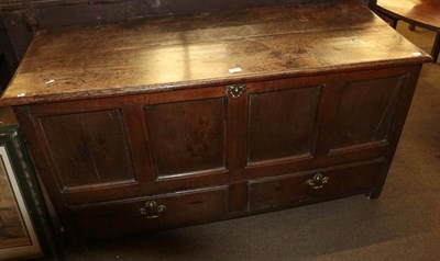 Lot 1146 - An early 18th century joined oak chest, the hinged lid above four moulded panels with two deep...