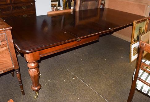 Lot 1147 - A Victorian mahogany extending dining table with three additional leaves, raised on octagonal...