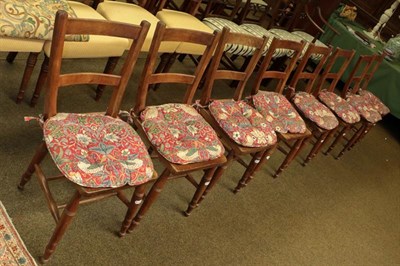Lot 1148 - A set of eight early 20th century mahogany kitchen chairs raised on turned supports with squab...