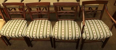 Lot 1150 - A set of four Regency mahogany dining chairs with reeded mouldings, overstuffed seats and including