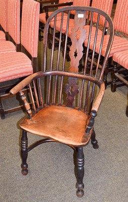 Lot 1162 - A 19th century ash and elm Windsor armchair with crinoline stretcher