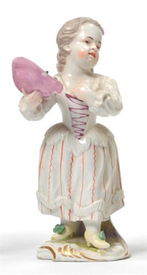 Lot 140 - A Frankenthal Porcelain Figure of a Girl, circa 1770, in white dress with orange striped skirts...
